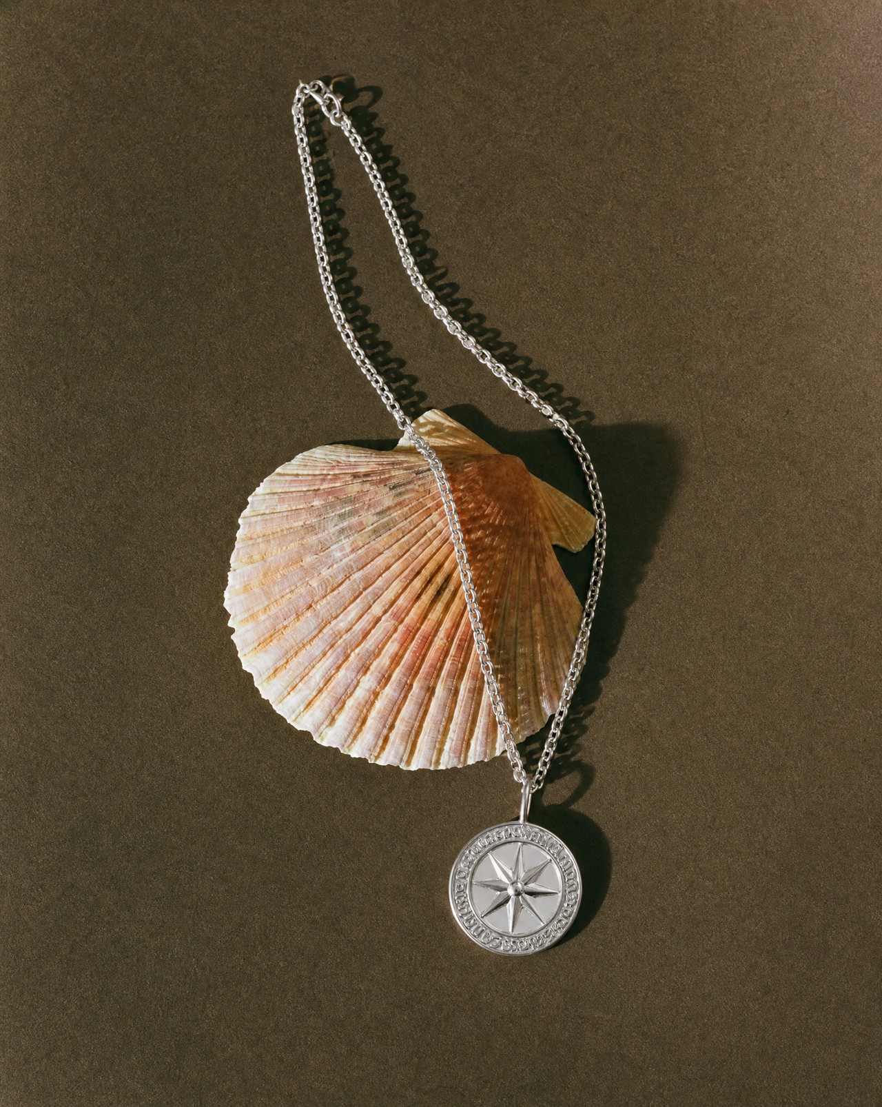 Ancient coin pendant Compass
